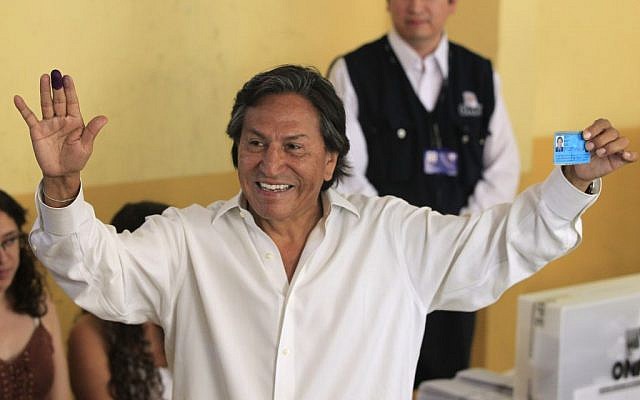In this April 10, 2011 file photo, then presidential candidate Alejandro Toledo holds up his ink-stained finger and identification card after voting in the general elections, in Lima, Peru. (AP Photo/Martin Mejia, File) In this April 10, 2011 file photo, then presidential candidate Alejandro Toledo holds up his ink-stained finger and identification card after voting in the general elections, in Lima, Peru. (AP Photo/Martin Mejia, File)