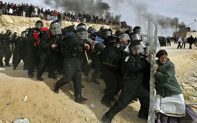 This Pulitzer Prize winning photograph by Oded Balilty shows Israeli settlers challenging security forces at the West Bank outpost of Amona on February 1, 2006. (AP Photo/Oded Balilty) This Pulitzer Prize winning photograph by Oded Balilty shows Israeli settlers challenging security forces at the West Bank outpost of Amona on February 1, 2006. (AP Photo/Oded Balilty)
