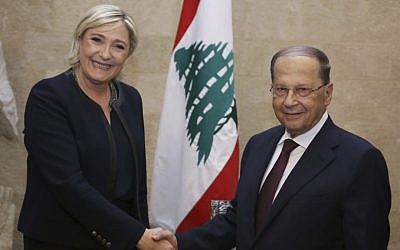 French far-right leader and presidential candidate Marine Le Pen, left, shakes hands with Lebanese President Michel Aoun, at the presidential palace, in Baabda, east Beirut, Lebanon, Monday, Feb. 20, 2017. (Dalati Nohra via AP)