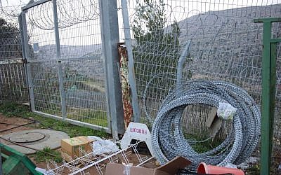Coils of barbed wire leftover from efforts to shore up a fence near a kindergarten in the Beit Horon settlement, near Jerusalem, where Shlomit Krigman was stabbed to death a year earlier, on February 12, 2017. (Judah Ari Gross/Times of Israel) Coils of barbed wire leftover from efforts to shore up a fence near a kindergarten in the Beit Horon settlement, near Jerusalem, where Shlomit Krigman was stabbed to death a year earlier, on February 12, 2017. (Judah Ari Gross/Times of Israel)