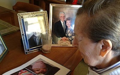 Sobel's mother, Manya, reading his first book for adults with memory loss, 'Blue Sky, White Clouds.' (Courtesy of Eliezer Sobel/via JTA)