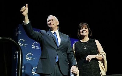 Vice President Mike Pence, left, takes the stage with his wife Karen Pence at the Republican Jewish Coalition annual leadership meeting, Friday, Feb. 24, 2017, in Las Vegas. (AP Photo/John Locher)
