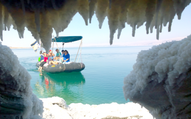 Jaky Ben Zaken‘s boat on the Dead Sea seen from a salt cave. (courtesy Noam Bedein)