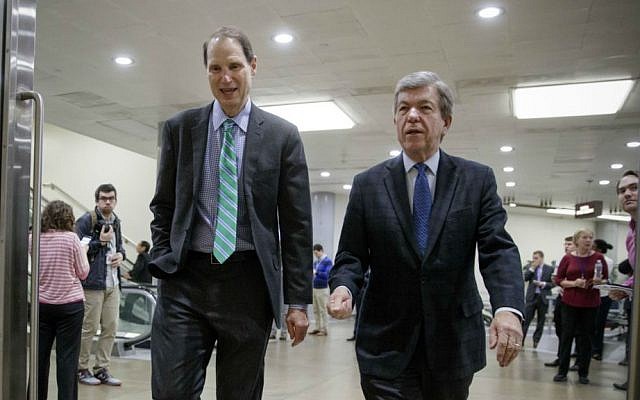 Sen. Ron Wyden, D-Oregon, left, and Sen. Roy Blunt, R-Missouri, walk to a closed intelligence briefing with FBI Director James Comey, Friday, Feb. 17, 2017, on Capitol Hill in Washington. (AP Photo/J. Scott Applewhite) Sen. Ron Wyden, D-Oregon, left, and Sen. Roy Blunt, R-Missouri, walk to a closed intelligence briefing with FBI Director James Comey, Friday, Feb. 17, 2017, on Capitol Hill in Washington. (AP Photo/J. Scott Applewhite)