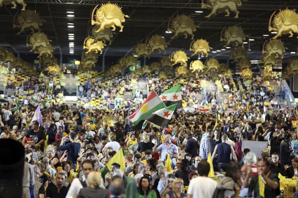 Thousands of exiled Iranians gathered in Villepinte, north of Paris, to listen to the speech of Maryam Rajavi, the leader of the National Council of Resistance of Iran, Friday June 27, 2014. (AP Photo/Rermy de la Mauviniere) Thousands of exiled Iranians gathered in Villepinte, north of Paris, to listen to the speech of Maryam Rajavi, the leader of the National Council of Resistance of Iran, Friday June 27, 2014. (AP Photo/Rermy de la Mauviniere)