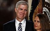 Judge Neil Gorsuch stands with his wife Louise as President Donald Trump speaks in the East Room of the White House in Washington, Tuesday, Jan. 31, 2017 (AP Photo/Carolyn Kaster)
