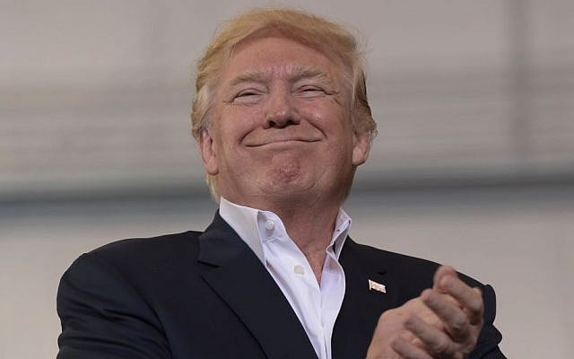 President Donald Trump smiles as he prepares to speak at his "Make America Great Again Rally" at Orlando-Melbourne International Airport in Melbourne, Florida., February 18, 2017. (AP/Susan Walsh)