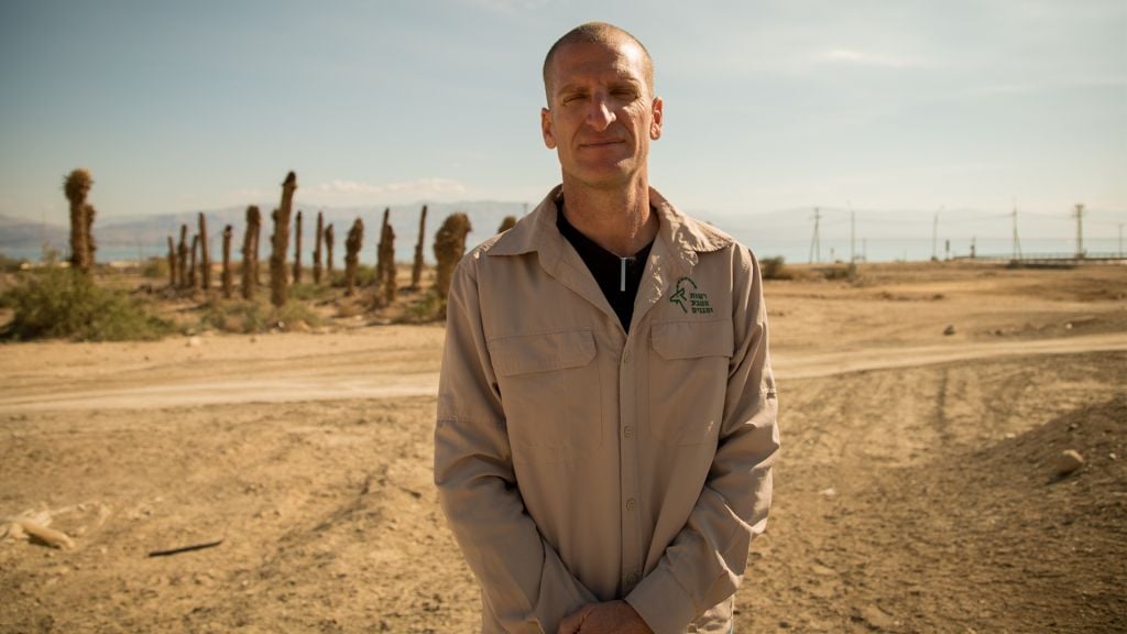 Harel Ben Shahar, the director of the Arava Region for Nature and Park’s Authority, which includes the Ein Gedi reserve, stands in front of an abandoned date orchard near the nature reserve on January 3, 2017. (Luke Tress/Times of Israel) Harel Ben Shahar, the director of the Arava Region for Nature and Park’s Authority, which includes the Ein Gedi reserve, stands in front of an abandoned date orchard near the nature reserve on January 3, 2017. (Luke Tress/Times of Israel)