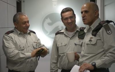 From left, IDF Chief of Staff Lt. Gen. Gadi Eisenkot speaks to incoming IDF spokesperson Col. Ronen Manelis and former head of the Southern Command Maj. Gen. (res.) Sami Turgeman in an undated photograph. (IDF Spokesperson's Unit)