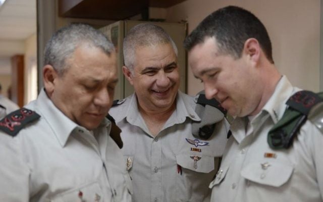 From left, IDF Chief of Staff Lt. Gen. Gadi Eisenkot, outgoing IDF Spokesperson Maj. Gen. Moti Almoz and incoming spokesperson Col. Ronen Manelis in an undated photograph. (IDF Spokesperson's Unit) From left, IDF Chief of Staff Lt. Gen. Gadi Eisenkot, outgoing IDF Spokesperson Maj. Gen. Moti Almoz and incoming spokesperson Col. Ronen Manelis in an undated photograph. (IDF Spokesperson's Unit)