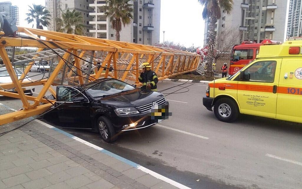 A crane that collapsed at a construction site in the central Israel city of Bat Yam on February 13, 2017. (Magen David Adom) A crane that collapsed at a construction site in the central Israel city of Bat Yam on February 13, 2017. (Magen David Adom)