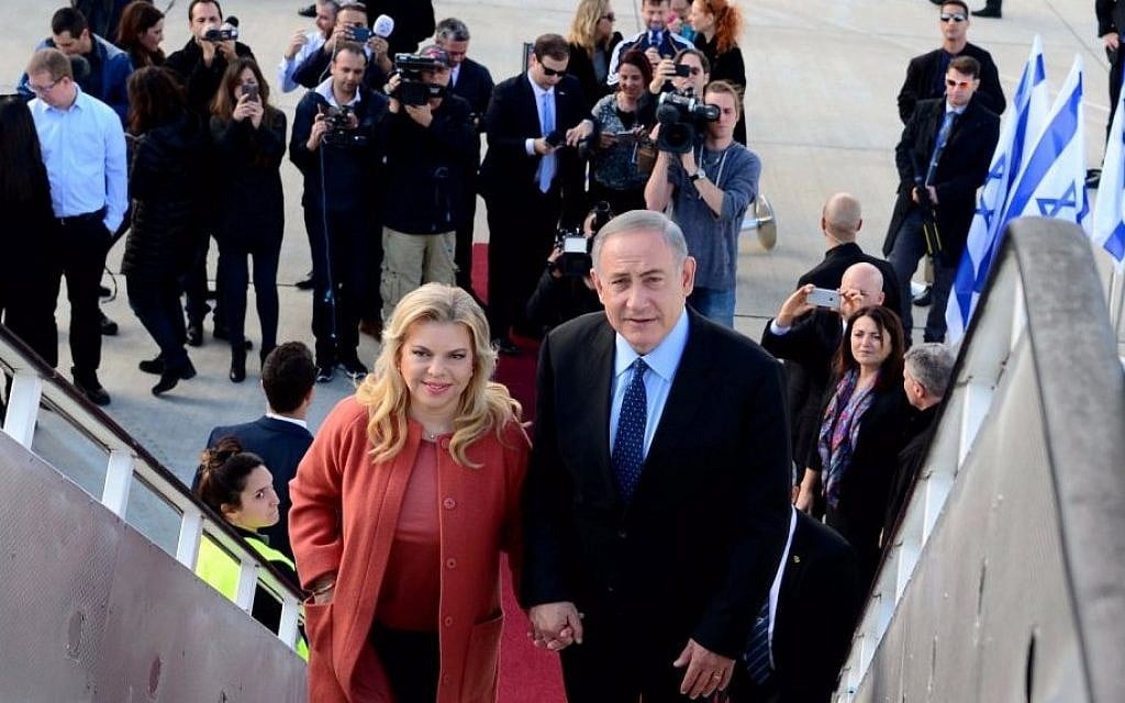 Benjamin Netanyahu, right, with his wife Sara Netanyahu, boarding a plane to the US, at Ben-Gurion Airport, on February 13, 2017. (Avi Ohayun/GPO) Benjamin Netanyahu, right, with his wife Sara Netanyahu, boarding a plane to the US, at Ben-Gurion Airport, on February 13, 2017. (Avi Ohayun/GPO)