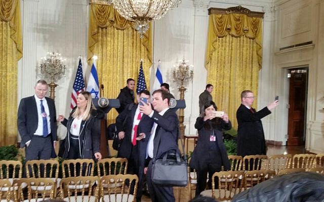 Israeli reporters taking selfies in the East Room of the White House on February 15, 2017. (Raphael Ahren/Times of Israel)
