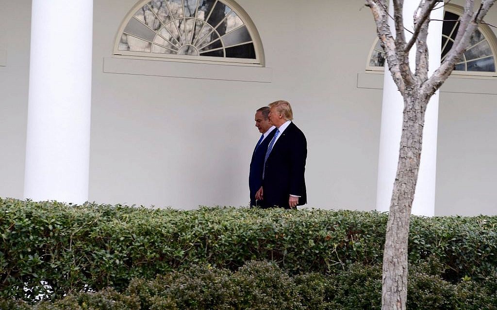Donald Trump, right, and Benjamin Netanyahu, walking in the White House grounds on February 15, 2017. (Avi Ohayun/GPO)