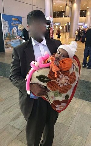 Two-year-old Yacub and his father arrive in Ben Gurion airport on February 14th, 2017. (Courtesy) 