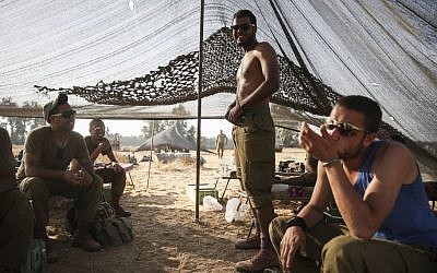 Bedouin IDF soldiers seen in a tent they set up in a field, near the Gaza border in southern Israel, on July 6, 2014. Photo by Hadas Parush/Flash90