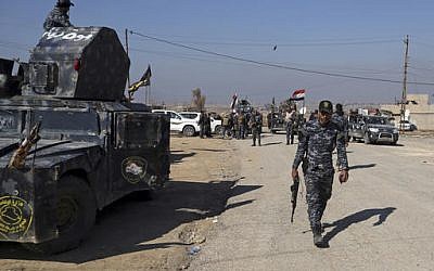 Iraqi Federal police deploy after regaining control of the town of Abu Saif, west of Mosul, Iraq, Wednesday, Feb. 22, 2017. (Khalid Mohammed/AP)