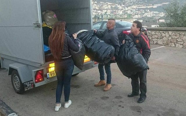 Israeli volunteers packing winter supplies to be delivered to Syrian refugees. (Operation Human Warmth) Israeli volunteers packing winter supplies to be delivered to Syrian refugees. (Operation Human Warmth)