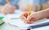 Illustrative: A student writing. (Getty images)