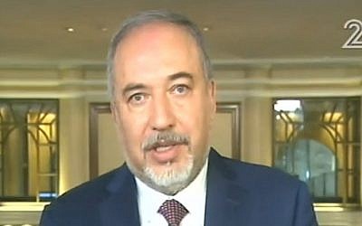 Defense Minister Avigdor Liberman talks to Israeli TV from a security conference in Munich, Germany on February 17, 2017 (screen capture: Channel 2)