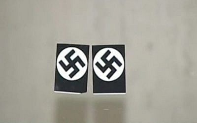 Swastika stickers were placed on the door of the Loop Synagogue in Chicago on February 4, 2017, in what local police said was a hate crime. (screen capture: NBC Chicago)