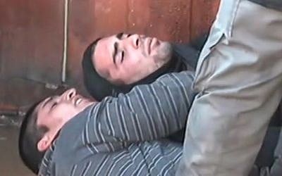Opponents of the evacuation of the illegal outpost of Amona lying on the floor of the synagogue, where protesters have barricaded themselves inside. (Screen capture: Channel 10)