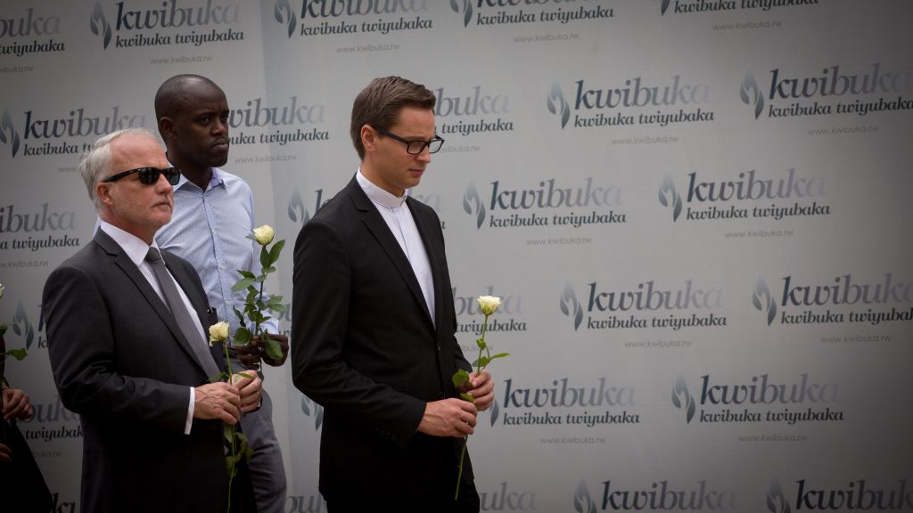 Dignitaries lay roses on the mass graves at the Kigali Genocide Memorial in February 14, 2017 under a sign that reads "to remember and going forward." The remains of 250,000 Tutsi victims of the genocide are buried on the museum grounds. (Miriam Alster/Flash90)