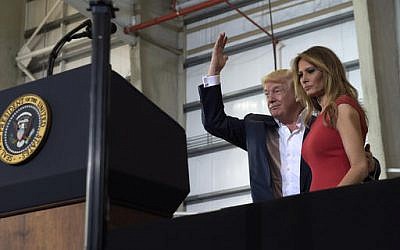 US President Donald Trump and first lady Melania Trump arrive to speak at his "Make America Great Again Rally" at Orlando-Melbourne International Airport in Melbourne, Fla., Saturday, Feb. 18, 2017. (Susan Walsh/AP)