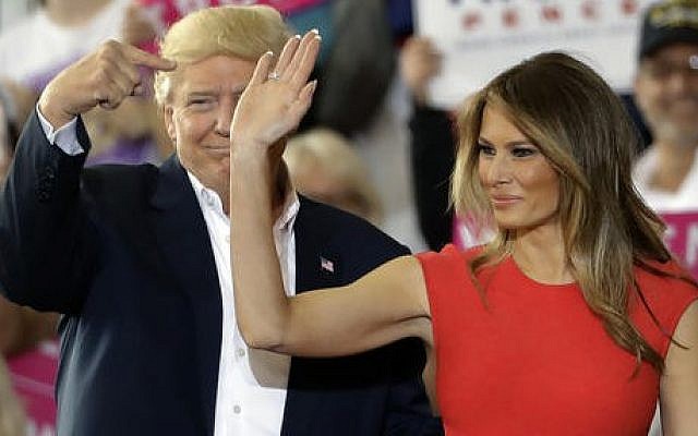 US President Donald Trump points to his wife, first lady Melania Trump during a campaign rally Saturday, Feb. 18, 2017, at Orlando-Melbourne International Airport, in Melbourne, Fla. (Chris O'Meara/AP) US President Donald Trump points to his wife, first lady Melania Trump during a campaign rally Saturday, Feb. 18, 2017, at Orlando-Melbourne International Airport, in Melbourne, Fla. (Chris O'Meara/AP)