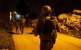 Illustrative: IDF soldiers during an arrest raid in the central West Bank on February 23, 2017. (Israel Defense Forces)