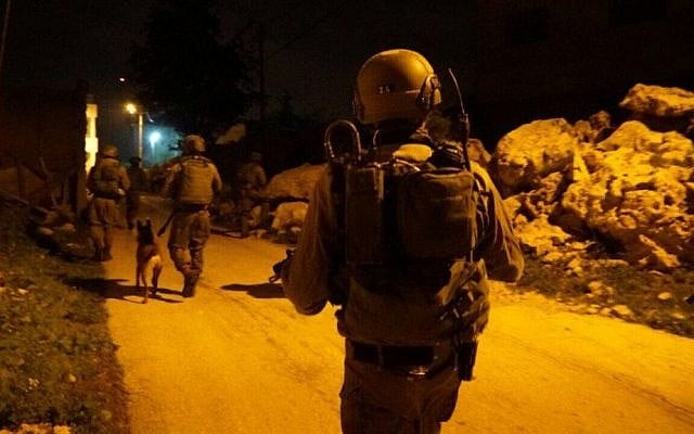 Illustrative: IDF soldiers during an arrest raid in the central West Bank on February 23, 2017. (Israel Defense Forces) Illustrative: IDF soldiers during an arrest raid in the central West Bank on February 23, 2017. (Israel Defense Forces)