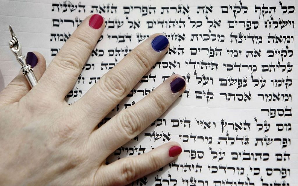 Illustrative image of a woman reading from the Scroll of Esther. (Miriam Alster/Flash90)