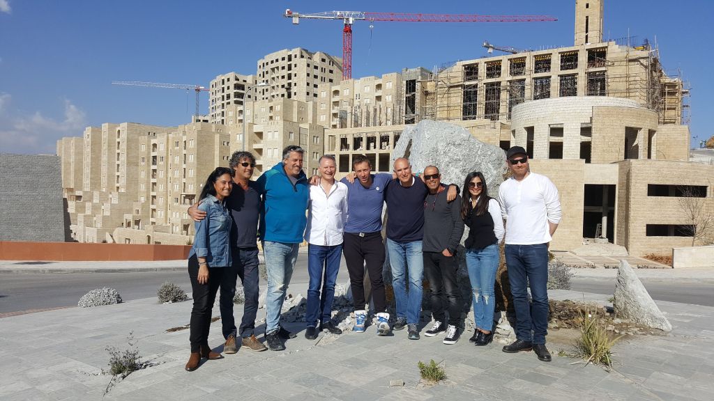 Members of Coldplay (lead singer Chris Martin is in the middle), Israeli producers and others on what appears to be a scouting trip for locations for a future Coldplay performance in Israel and the West Bank (Courtesy Nidar Oz Communications)