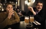 Jafar Farah (R) and his wife Asmahan Atwan Farah drink beer at the Libira Brewery pub in Haifa on February 23, 2017. (AFP Photo/Menahem Kahana)