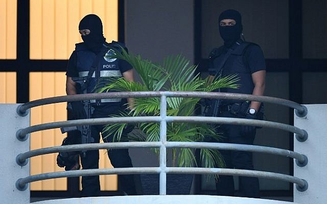 Masked Malaysian policemen keep watch ahead of the court appearance of Indonesian national Siti Aisyah, 25, and Vietnamese national Doan Thi Huong, 28, at the magistrates' court in Sepang on March 1, 2017, for their alleged role in the assassination of Kim Jong-Nam, the half-brother of North Korean leader Kim Jong-Un. (AFP/Mohd Rasfan) Masked Malaysian policemen keep watch ahead of the court appearance of Indonesian national Siti Aisyah, 25, and Vietnamese national Doan Thi Huong, 28, at the magistrates' court in Sepang on March 1, 2017, for their alleged role in the assassination of Kim Jong-Nam, the half-brother of North Korean leader Kim Jong-Un. (AFP/Mohd Rasfan)