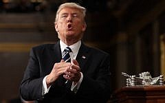 US President Donald J. Trump reacts after delivering his first address to a joint session of Congress from the floor of the House of Representatives in Washington, DC, USA, 28 February 2017. (AFP Photo/Pool/Jim Lo Scalzo)