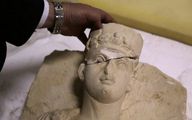 A picture taken at the National Museum in Damascus on March 1, 2017 shows a rare bust rescued from the Islamic State group in the ancient city of Palmyra awaiting to be restored, after it was returned to Syria. (AFP PHOTO / Louai Beshara)