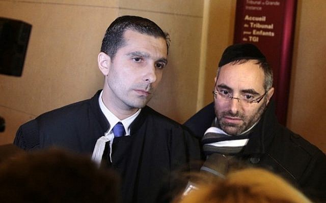 Benjamin Amsellem (R), a Jewish teacher who was stabbed by a 15-year-old student with a machete in January 2016, speaks to journalists, flanked by his lawyer Fabrice Labi, during the teenager's trial at the juvenile court of the Palais de Justice in Paris on March 1, 2017. (AFP/Geoffroy van der Hasselt)