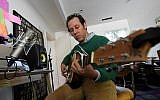 Australian musician Ben Lee rehearses inside his home studio in Los Angeles, California on March 2, 2017. (AFP PHOTO / Mark RALSTON)