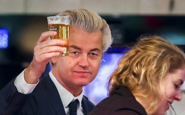 Dutch member of Parliament and leader of the far-right Party for Freedom (PVV) Geert Wilders, center, raises his glass in a cafe during a visit to the town of Volendam, on March 3, 2017, ahead of March 15 general elections. (AFP/ ANP / Jerry Lampen) Dutch member of Parliament and leader of the far-right Party for Freedom (PVV) Geert Wilders, center, raises his glass in a cafe during a visit to the town of Volendam, on March 3, 2017, ahead of March 15 general elections. (AFP/ ANP / Jerry Lampen)