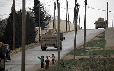 Manbij Military Council forces, part of the US-backed Syrian Democratic Forces (SDF), drive a humvee as they patrol the surrounding roads of in the northern Syrian town of Manbij on March 3, 2017. (AFP/Delil Souleiman)