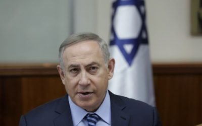Israeli Prime Minister Benjamin Netanyahu chairs the weekly cabinet meeting in Jerusalem on March 5, 2017. (AFP Photo/EPA Pool and AFP Photo/Abir Sultan)