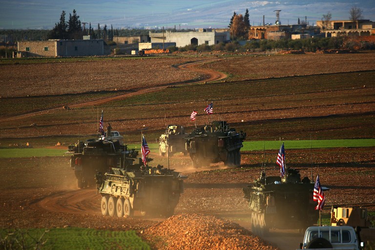 This file photo taken on March 5, 2017 shows a convoy of US forces armored vehicles driving near the village of Yalanli, on the western outskirts of the northern Syrian city of Manbij. (AFP Photo/Delil Souleiman) This file photo taken on March 5, 2017 shows a convoy of US forces armored vehicles driving near the village of Yalanli, on the western outskirts of the northern Syrian city of Manbij. (AFP Photo/Delil Souleiman)