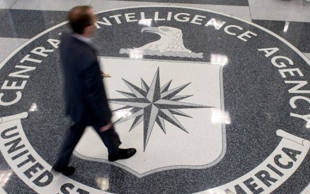 This file photo taken on August 13, 2008, shows a man walking over the seal of the Central Intelligence Agency (CIA) in the lobby of CIA headquarters in Langley, Virginia. (AFP/Saul Loeb) This file photo taken on August 13, 2008, shows a man walking over the seal of the Central Intelligence Agency (CIA) in the lobby of CIA headquarters in Langley, Virginia. (AFP/Saul Loeb)