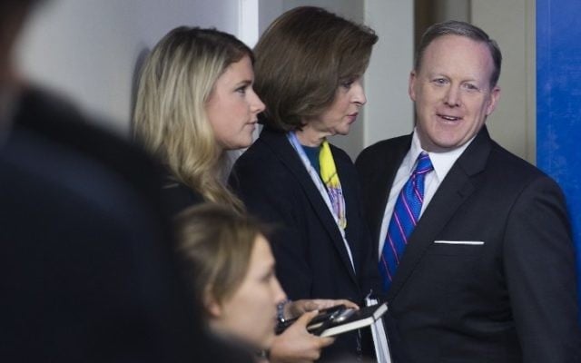 White House Press Secretary Sean Spicer (R) arrives for the daily press briefing at the White House in Washington, DC, March 8, 2017. (AFP PHOTO / JIM WATSON)