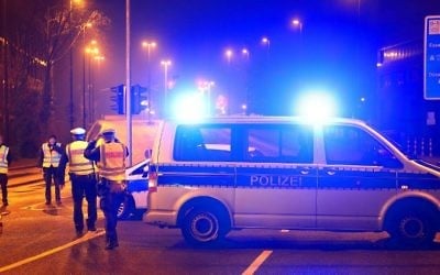 Policemen block a road near the site where a unexploded World War II bomb was found in Duesseldorf, western Germany, on March 8, 20171. (David Young/AFP)