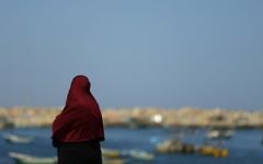 A woman looks at the sea as Palestinian families of fishermen shout slogans during a protest against Israel's blockade on the Gaza Strip on March 9, 2017 in Gaza City. (AFP/Mohammed Abed)