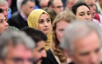 Illustrative: A woman looks on as people take part in a debate on role of Islam in the country ahead of the Dutch parliamentary elections at the Essalam mosque, the country's largest, in Rotterdam on March 10, 2017. (AFP PHOTO / EMMANUEL DUNAND)
