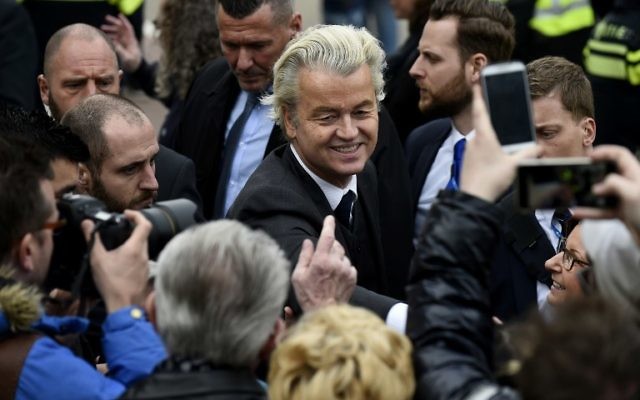 Dutch far-right Freedom Party leader (Partij Voor De Vrijheid, PVV) Geert Wilders is guarded by police as he meets with supporters in Heerlen on March 11, 2017. (AFP PHOTO / JOHN THYS) Dutch far-right Freedom Party leader (Partij Voor De Vrijheid, PVV) Geert Wilders is guarded by police as he meets with supporters in Heerlen on March 11, 2017. (AFP PHOTO / JOHN THYS)