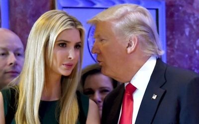 This file photo taken on January 11, 2017 shows US President-elect Donald Trump talking to his daughter Ivanka during a press conference at Trump Tower in New York. (AFP PHOTO / Timothy A. CLARY)